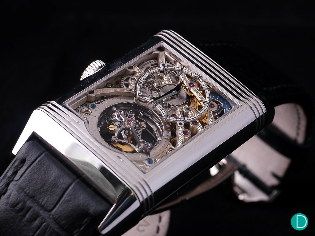 The back dial is skeletonized to show more of the movement. The dial proper itself is heavily skeletonized and a am/pm indicator is visible at 2 o'clock.