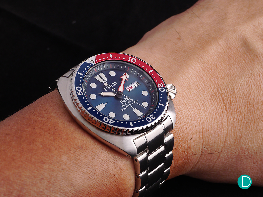On the wrist, the 45mm case feels rather comfortable. Perhaps due to the curves on the case as well as the smooth matt finish. But the heft tells the wearer that it is a tough and robust watch replica ready for almost anything. And well adapted for diving as well as being a part of a casual wardrobe.